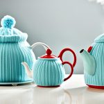 What are the benefits of using a tea timer with a tea set?